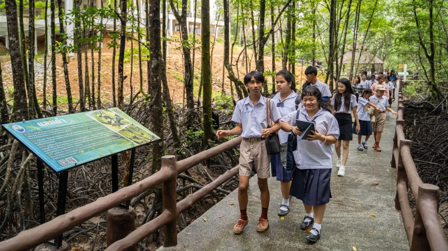 A group of students walk through the Ranong Biosphere Reserve